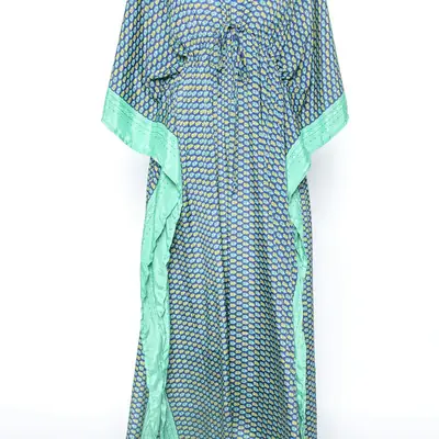 A long patterned kaftan with green trim