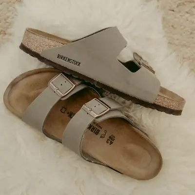 A pair of flat two-strap sandals