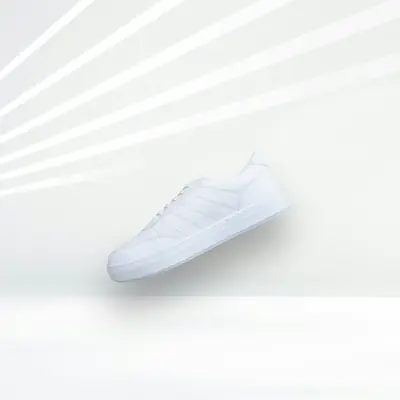 A plain white trainer on a white background